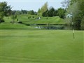 2006 Irland, St Margerets golf club (LJo) damm från bakom green.JPG